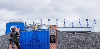 Dixie Dean statue in front of the Wall of Fame outside Goodison Park, the home of Everton FC.